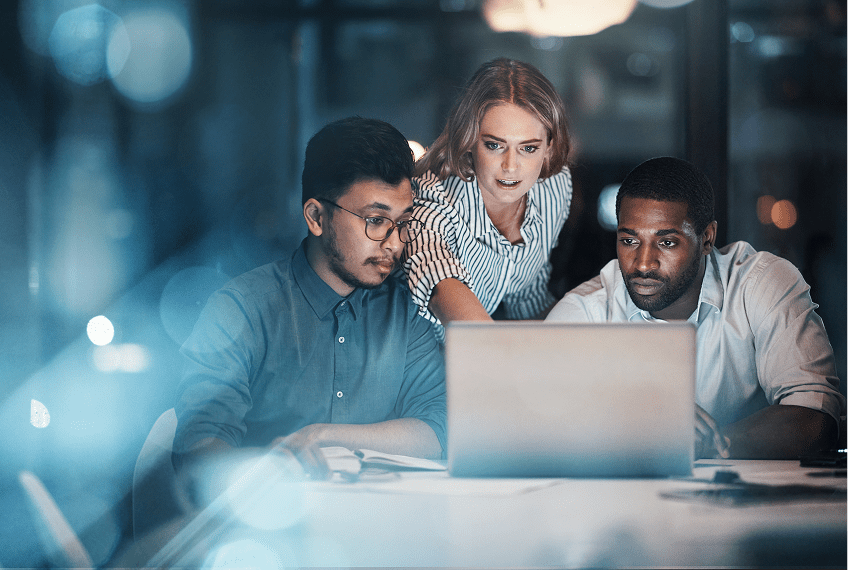 Team collaborating over a laptop